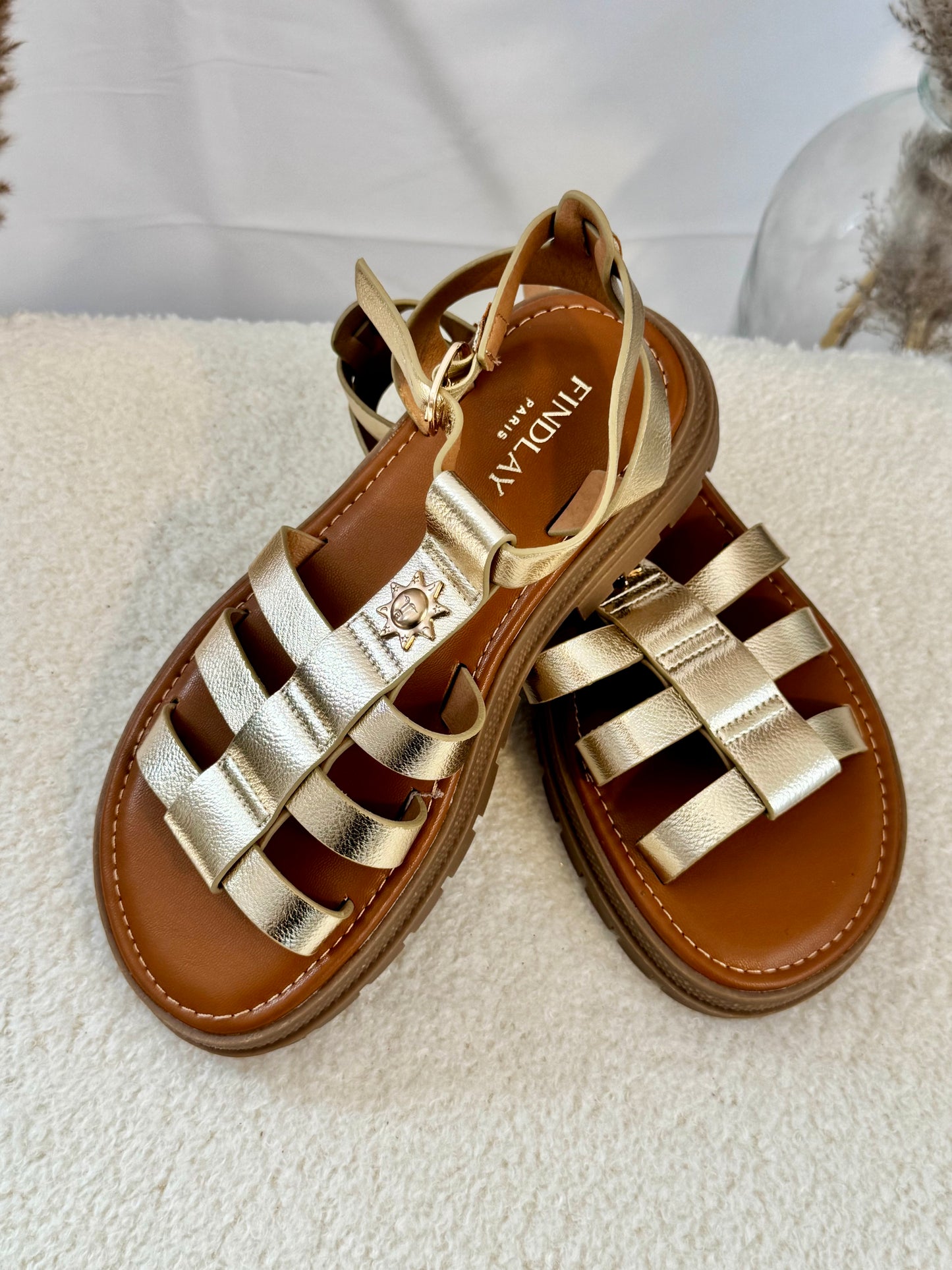 Chaussures haute soleil dorée